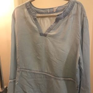Light blue denim blouse.